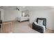 Spacious main bedroom with plush carpet, and a leather recliner at 8923 Happiness Rd, Harrisburg, NC 28075