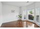 Bright office space with hardwood floors and a large window that provides natural light at 8923 Happiness Rd, Harrisburg, NC 28075