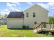 Back of house with wood deck and a green grass back yard at 9419 Isaac Hunter Dr, Charlotte, NC 28214