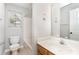 Bathroom with neutral walls, wood vanity, a large mirror, and tub with shower at 9419 Isaac Hunter Dr, Charlotte, NC 28214
