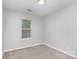 Bedroom featuring neutral colors and a window at 9419 Isaac Hunter Dr, Charlotte, NC 28214
