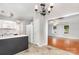 Bright kitchen showing a view of a large island and an archway to the open-concept living space at 9419 Isaac Hunter Dr, Charlotte, NC 28214