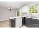 Functional kitchen featuring modern appliances, white countertops, and contrasting cabinetry at 9419 Isaac Hunter Dr, Charlotte, NC 28214