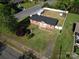 Aerial view of a brick home, fenced-in backyard, and a well-maintained lawn at 1005 Clarkson St, Rock Hill, SC 29730