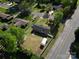 Aerial shot highlights the property with its enclosed yard, storage buildings, and neighborhood setting at 1005 Clarkson St, Rock Hill, SC 29730