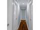 Hallway with neutral paint and hardwood floors with multiple doors at 1005 Clarkson St, Rock Hill, SC 29730