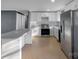 Bright kitchen boasts white cabinetry, stainless steel appliances, and ample counter space at 1005 Clarkson St, Rock Hill, SC 29730