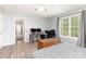 Large bedroom featuring natural light and hardwood flooring, perfect for relaxation and comfort at 103 Woodwinds St, Locust, NC 28097