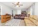 Comfortable living room showcasing hardwood floors, neutral walls, and a ceiling fan at 103 Woodwinds St, Locust, NC 28097
