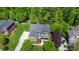 Aerial view showcasing the home's mature landscaping, driveway, and curb appeal at 10328 Lemington Dr, Mint Hill, NC 28227