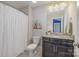 Well-maintained bathroom with a vanity, mirror, and shower-tub combo at 10328 Lemington Dr, Mint Hill, NC 28227