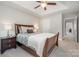 A comfortable bedroom shows a tray ceiling and neutral decor at 10328 Lemington Dr, Mint Hill, NC 28227