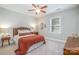 Bedroom with soft lighting, comfortable bed, carpet, and a window letting in natural light at 10328 Lemington Dr, Mint Hill, NC 28227