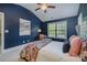 Tastefully decorated bedroom with a plush bed and a view of the lush outdoors at 10328 Lemington Dr, Mint Hill, NC 28227