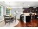 Eat-in kitchen with stainless steel appliances, breakfast bar, granite counters and adjacent dining area at 10328 Lemington Dr, Mint Hill, NC 28227