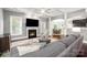 Open-concept living area with a fireplace and views to dining space at 10328 Lemington Dr, Mint Hill, NC 28227