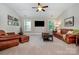 Relax in this large, cozy living room with leather furniture and lots of light at 10328 Lemington Dr, Mint Hill, NC 28227