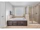 An ensuite bath with soaking tub and glass shower at 10328 Lemington Dr, Mint Hill, NC 28227