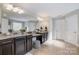 Dual vanities, granite countertops and access to multiple walk-in closets highlight this ensuite bath at 10328 Lemington Dr, Mint Hill, NC 28227