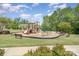 Community playground with swings, slides, and climbing structures at 10328 Lemington Dr, Mint Hill, NC 28227