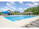 Large community pool with plenty of lounge chairs and a covered picnic area at 10328 Lemington Dr, Mint Hill, NC 28227