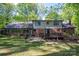 A two-story brick house with a spacious backyard and a cozy wooden deck at 1058 General Hoke Dr, Lincolnton, NC 28092