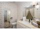 Cozy bathroom with floral wallpaper, a vanity, and a mirror reflecting the space at 1058 General Hoke Dr, Lincolnton, NC 28092