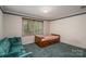 Cozy bedroom with a twin bed, comfortable couch, and plenty of natural light at 1058 General Hoke Dr, Lincolnton, NC 28092