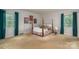 Bedroom with four poster bed, large windows, and neutral carpet at 1058 General Hoke Dr, Lincolnton, NC 28092