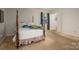 Bedroom featuring a four-poster bed, green drapes, and great natural light at 1058 General Hoke Dr, Lincolnton, NC 28092
