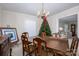Traditional dining room with a large wooden table, chandelier, and a festive Christmas tree at 1058 General Hoke Dr, Lincolnton, NC 28092