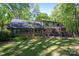 A two-story brick house with a spacious backyard and a cozy wooden deck at 1058 General Hoke Dr, Lincolnton, NC 28092
