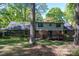 A two-story brick house with a spacious backyard and a cozy wooden deck at 1058 General Hoke Dr, Lincolnton, NC 28092