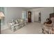 Inviting living room with floral sofa, grandfather clock, and an open view into other rooms at 1058 General Hoke Dr, Lincolnton, NC 28092