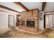 Living room highlights a brick fireplace and wood trim; adjoining rooms visible at 1058 General Hoke Dr, Lincolnton, NC 28092