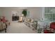 Bright living room with floral sofa, view to dining room, and ample natural light at 1058 General Hoke Dr, Lincolnton, NC 28092