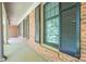 Charming brick porch with black shutters and stately columns at 1058 General Hoke Dr, Lincolnton, NC 28092