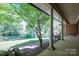 Inviting front porch with classic columns and a view of the lush front yard at 1058 General Hoke Dr, Lincolnton, NC 28092