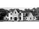 Elegant home with stone accents, a multi-car garage, and a beautifully landscaped front yard at 110 Hunts Landing Dr, Mooresville, NC 28117