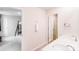 Well-lit bathroom offers double sinks and a door to the adjacent bedroom with bunk beds at 11215 Dappled Light Trl, Charlotte, NC 28227