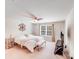 Bedroom with neutral colors, ceiling fan, large window, and TV with stand at 11215 Dappled Light Trl, Charlotte, NC 28227