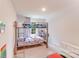 Bright bedroom with bunk beds, a window, and carpeted flooring creates a cozy and fun space at 11215 Dappled Light Trl, Charlotte, NC 28227