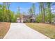 Charming two-story home featuring a two-car garage, inviting front porch and a basketball court at 11215 Dappled Light Trl, Charlotte, NC 28227