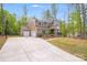 Charming two-story home featuring a two-car garage, inviting front porch and a basketball court at 11215 Dappled Light Trl, Charlotte, NC 28227
