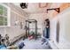 Spacious garage area equipped with exercise equipment and weights at 11215 Dappled Light Trl, Charlotte, NC 28227