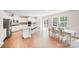 Spacious kitchen with white cabinets, stainless steel appliances, and a large center island at 11215 Dappled Light Trl, Charlotte, NC 28227