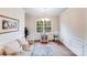 Bright living room featuring beautiful floors, crown molding, and lots of natural light from large windows at 11215 Dappled Light Trl, Charlotte, NC 28227