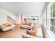 Open floor plan with hardwood floors connecting the living room, dining area, and kitchen at 11215 Dappled Light Trl, Charlotte, NC 28227