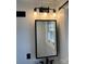 Updated bathroom features modern vanity with black trim and sleek lighting fixture at 1148 Marietta St, Charlotte, NC 28214