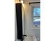 Updated bathroom features modern vanity and a view out the window at 1148 Marietta St, Charlotte, NC 28214